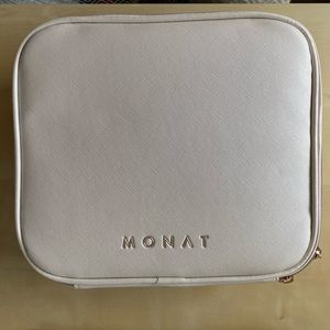 Beige toiletry bag. Brand: Monat
